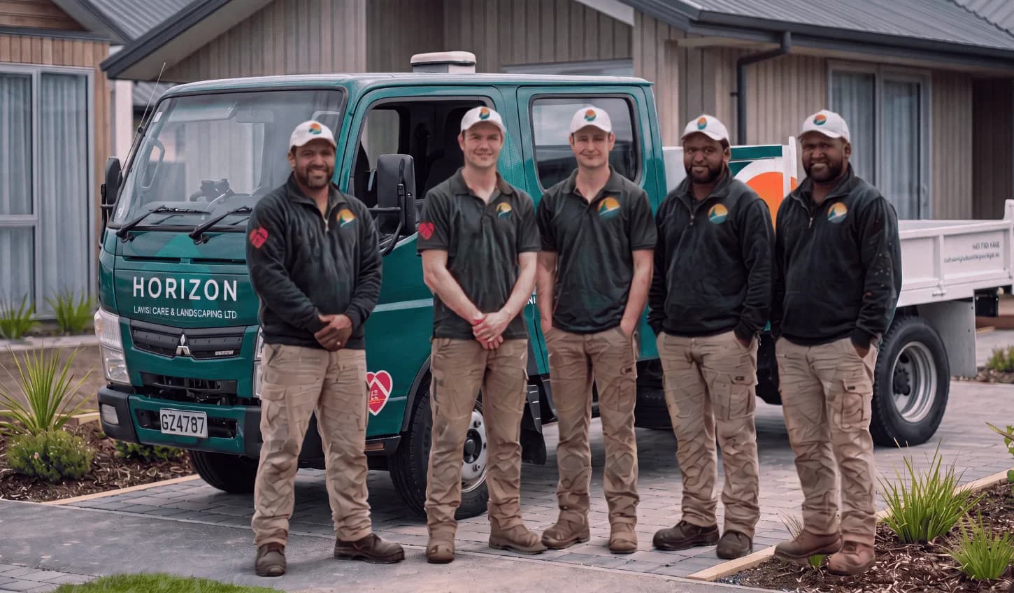 The Horizon crew with the company truck, wearing Hope to Homes badges