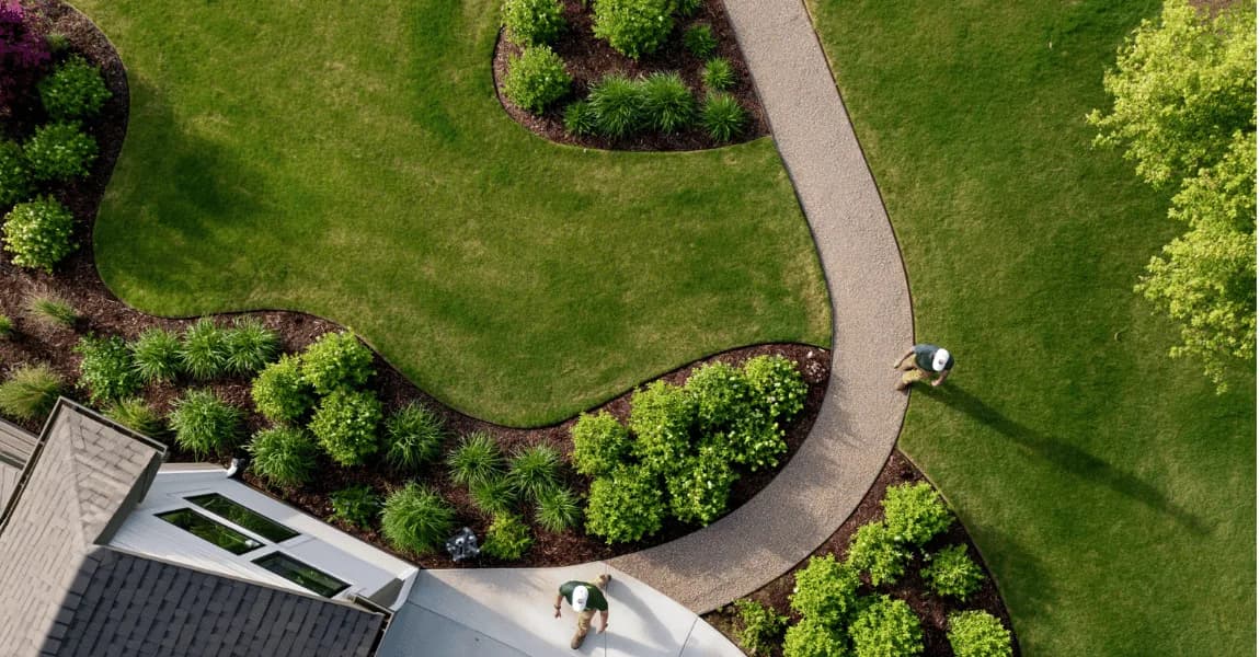 An aerial view of a maintained lawn and garden